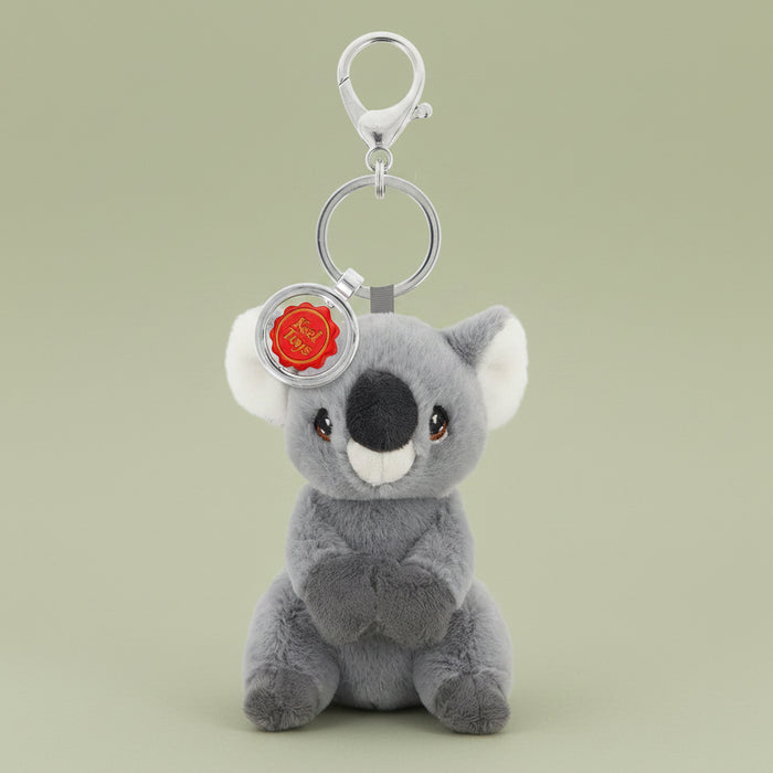 Plush koala keychain with a red flower on a white background