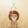 Plush lion keychain with a red emblem on a white background
