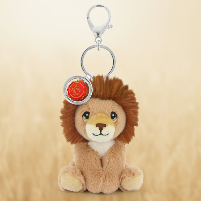 Plush lion keychain with a red emblem on a white background