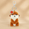 Plush meerkat keychain with a tag on a white background