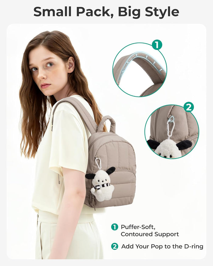 front d-ring for attaching charms and personal accessories, plus front quick-access zip compartment