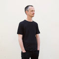 a man wearing a black t shirt