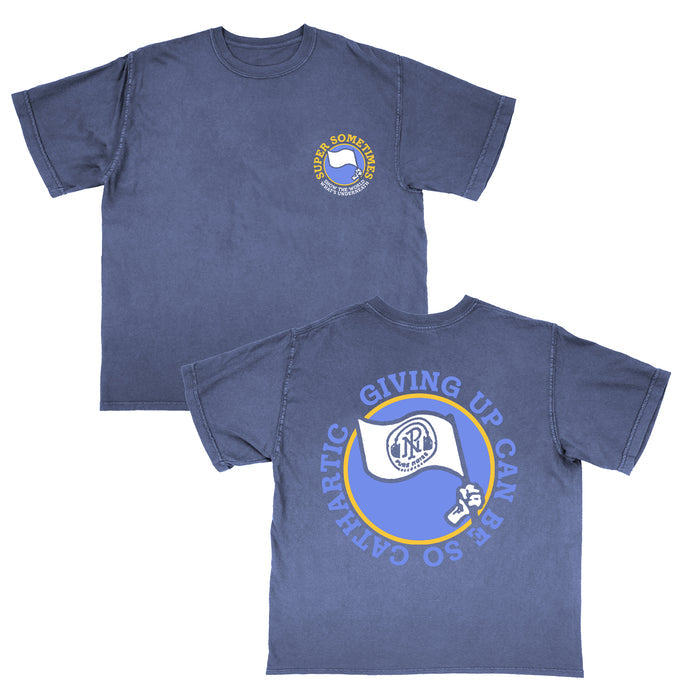 Super Sometimes blue Comfort Colors shirt with small flag logo and "Sometimes Giving Up Can Be So Cathartic" on front left chest; large flag graphic and bold phrase across the back.