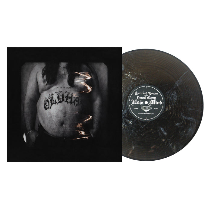 A marbled black and gray vinyl from Knocked Loose sits by its album cover, which shows a black-and-white photo of a shirtless person with 'OLDIE' tattooed on their stomach—perfect for fans of Hive Mind or Denzel Curry.