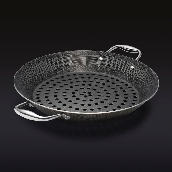 The HexClad 12&quot Hybrid BBQ Grill Pan on a black background