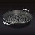 The HexClad 12&quot Hybrid BBQ Grill Pan on a black background