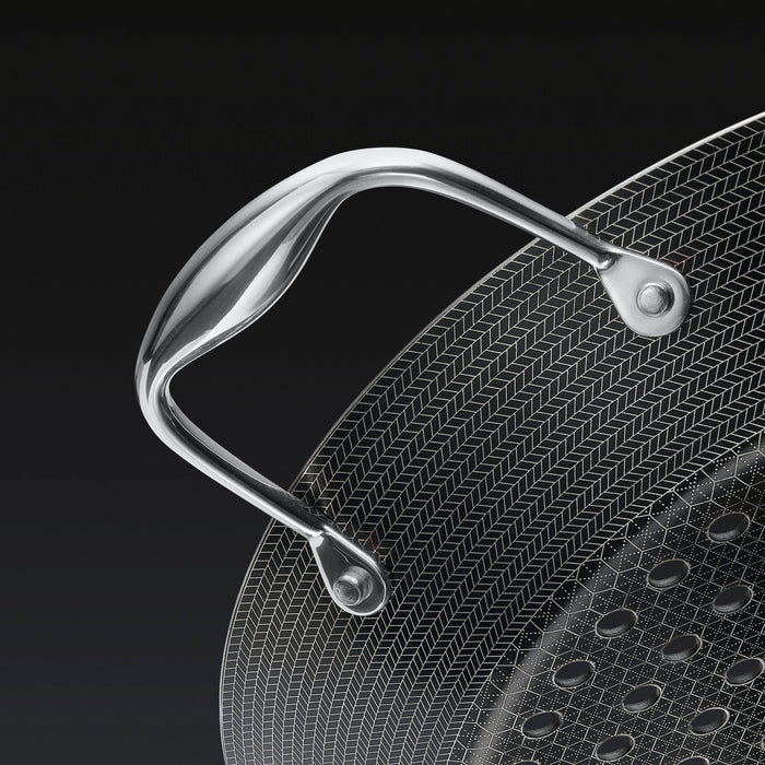 A close up of the handle of the HexClad 12&quot Hybrid BBQ Grill Pan