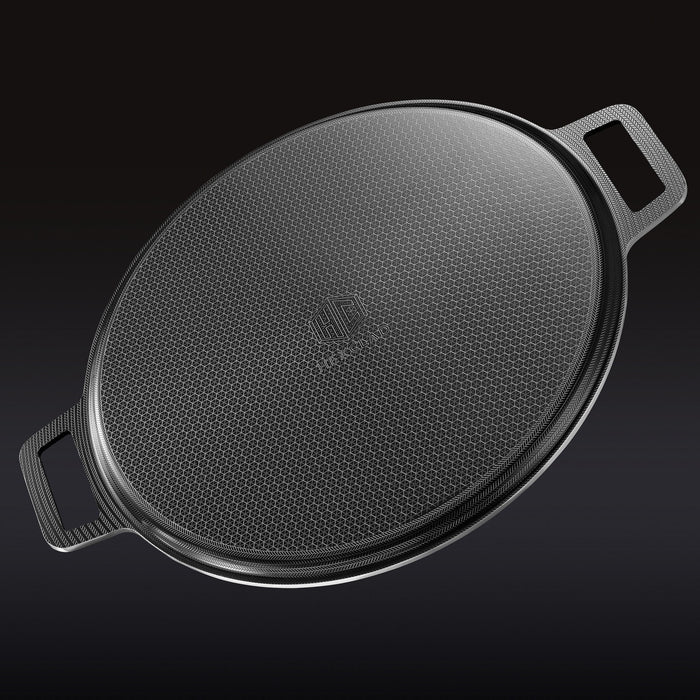 The underside of the HexClad hybrid pizza steel on a black background