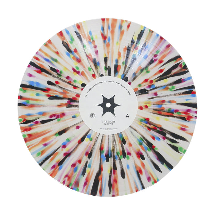 A limited edition 4th Press vinyl record from The Story So Far, featuring a white Milky Clear Rainbow Splatter design with colorful paint radiating outward from the center in a vibrant, abstract pattern. The center label displays black text and a black ninja star-like symbol.