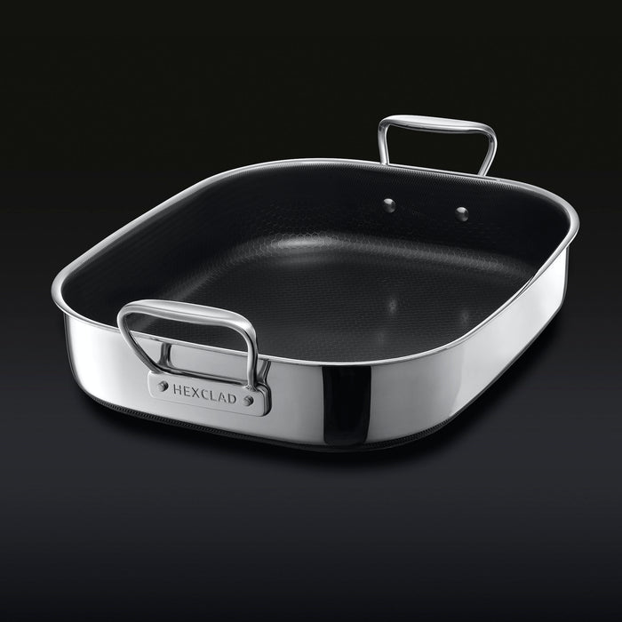 The HexClad Hybrid Roasting Pan on a black backround, shown from a diagonal viewpoint.