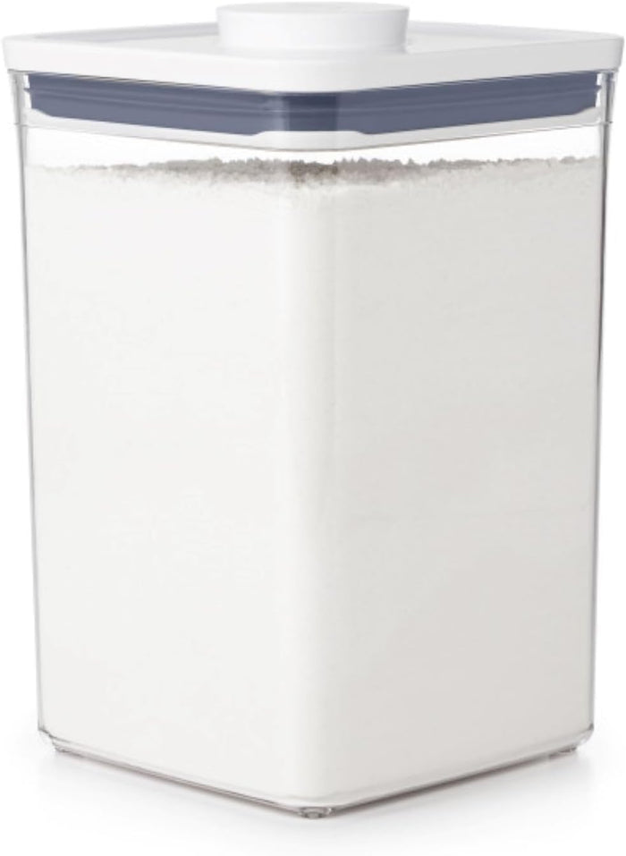 push-button lid that creates an airtight seal and doubles as an opening handle