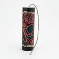 Thunder drum painted with colourful dots a spring attached to one end