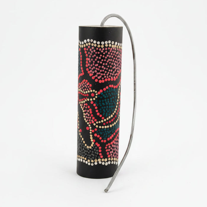 Thunder drum painted with colourful dots a spring attached to one end