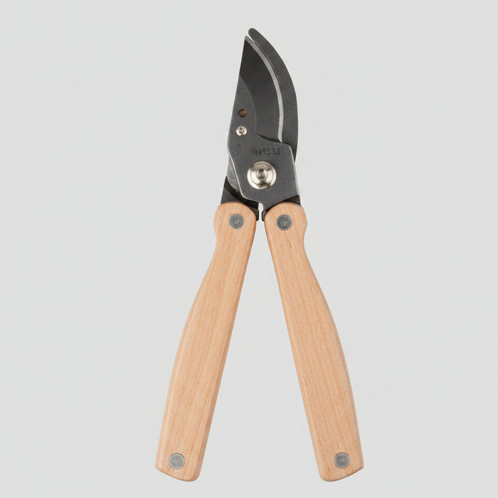 Garden pruner with wooden handles on a white background