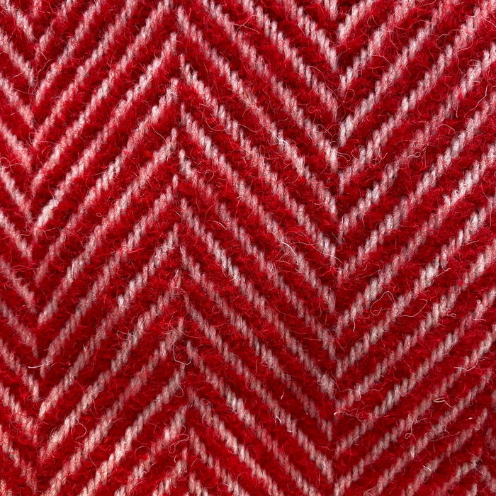 Close-up of red and white herringbone pattern blanket