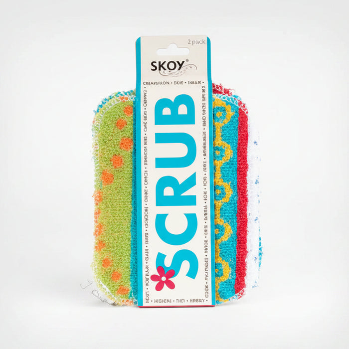 A pack of two colorful scrubber pads wrapped in a white cardboard sleeve labeled 'SKOY SCRUB'. The scrubbers are lime green with orange dots, turquoise blue with yellow swirls, and red with yellow swirls.