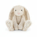 cream sitting bunny with very large ears