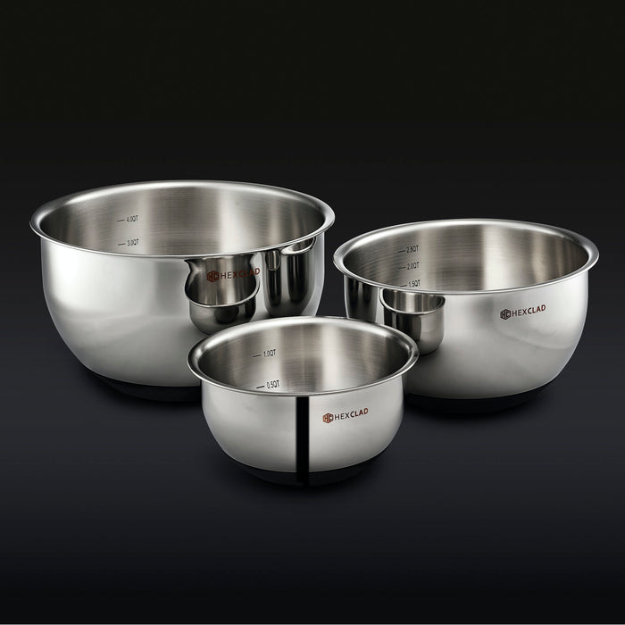 3 HexClad stainless steel mixing bowls on a black background.